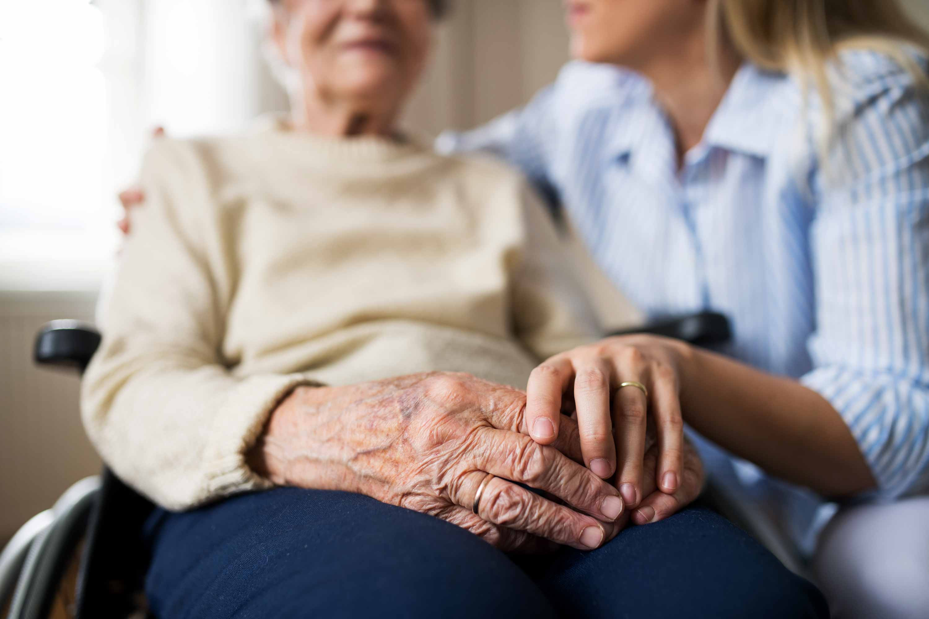 Caregiver and woman in wheelchair