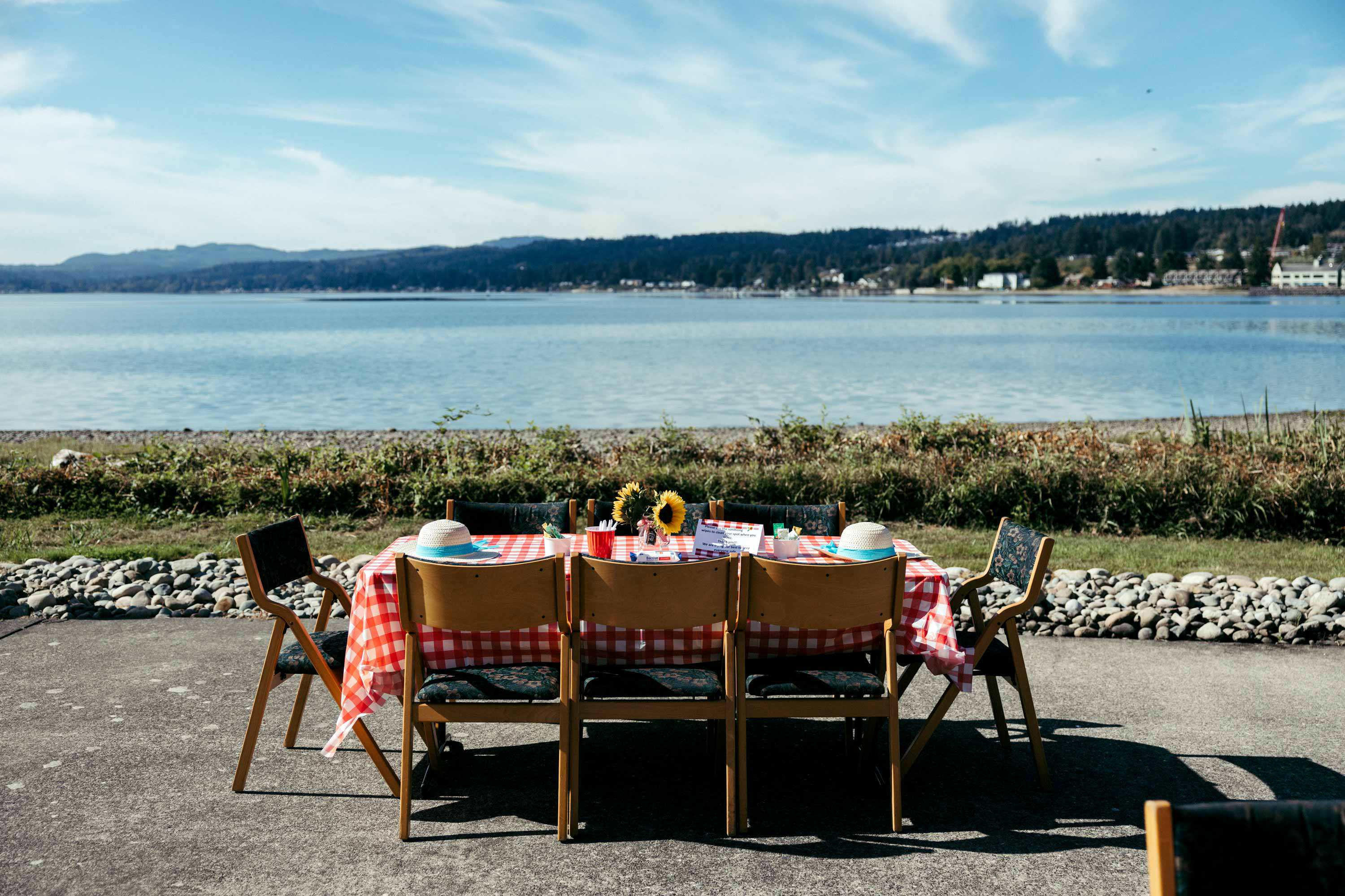 Table set on the waterfront patio at Crista Shores