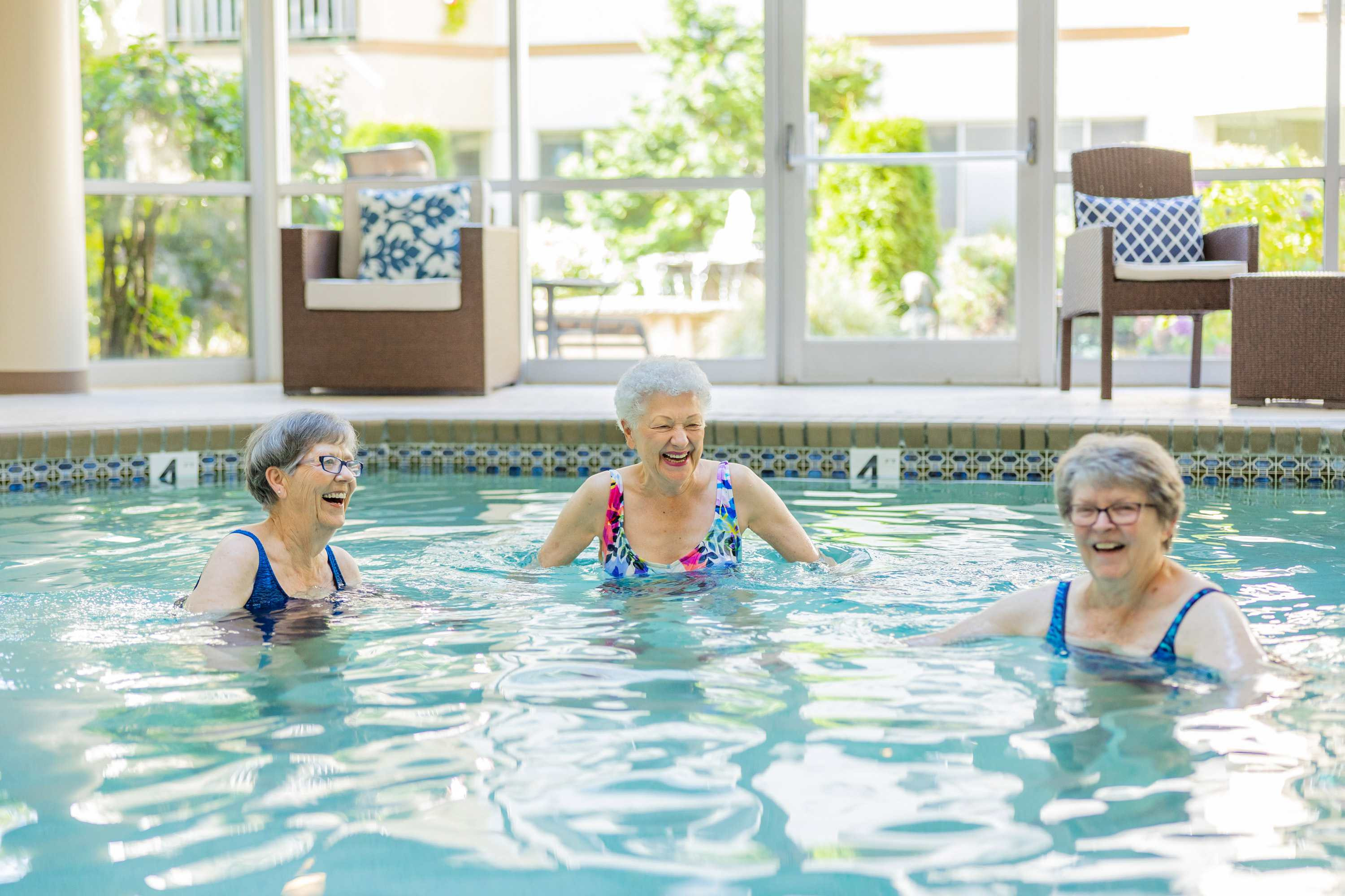 Three women enjoying Cristwood's spa fitness pool