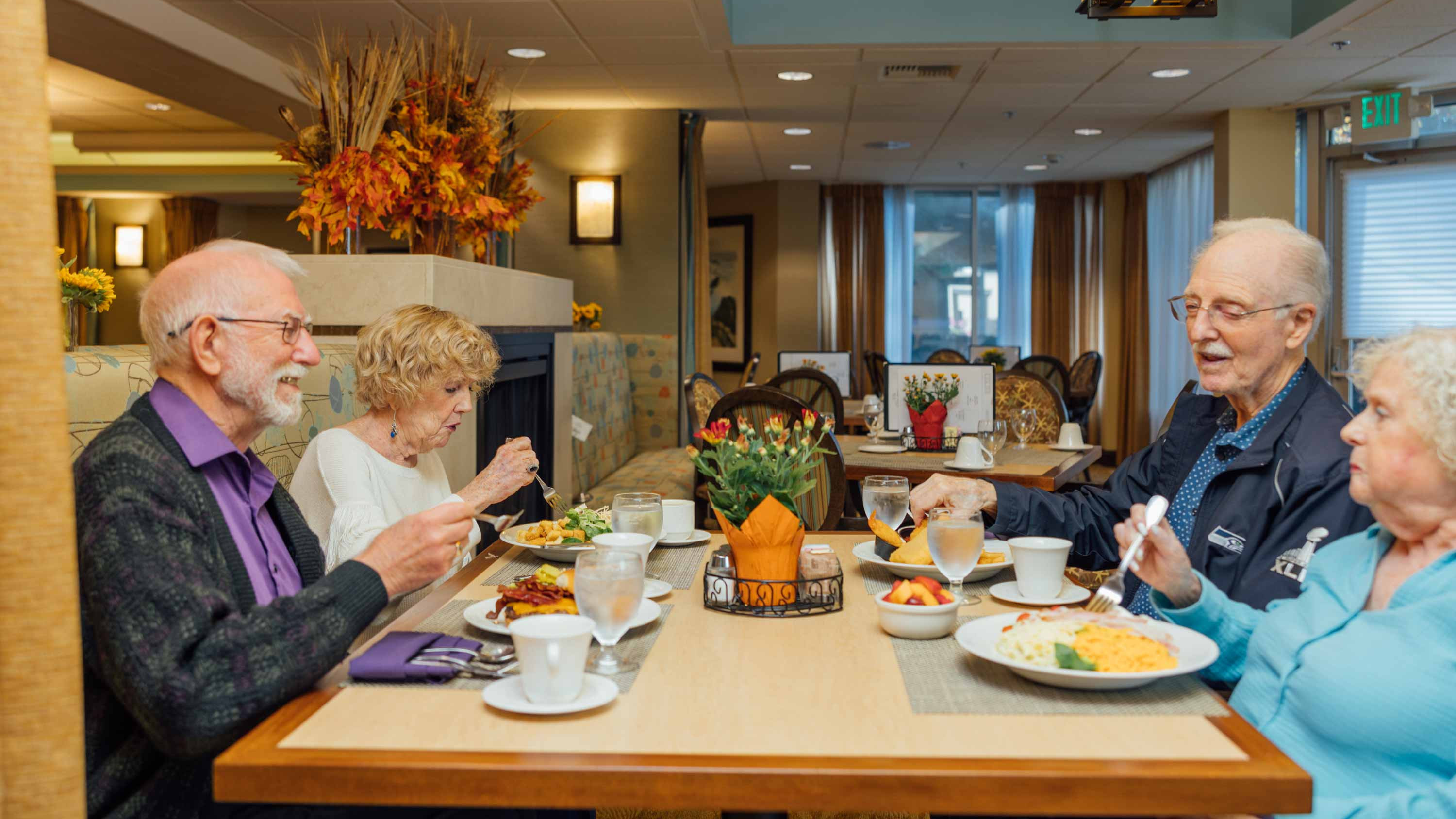 Two Cristwood couples enjoy dinner together at Cristwood Grotto