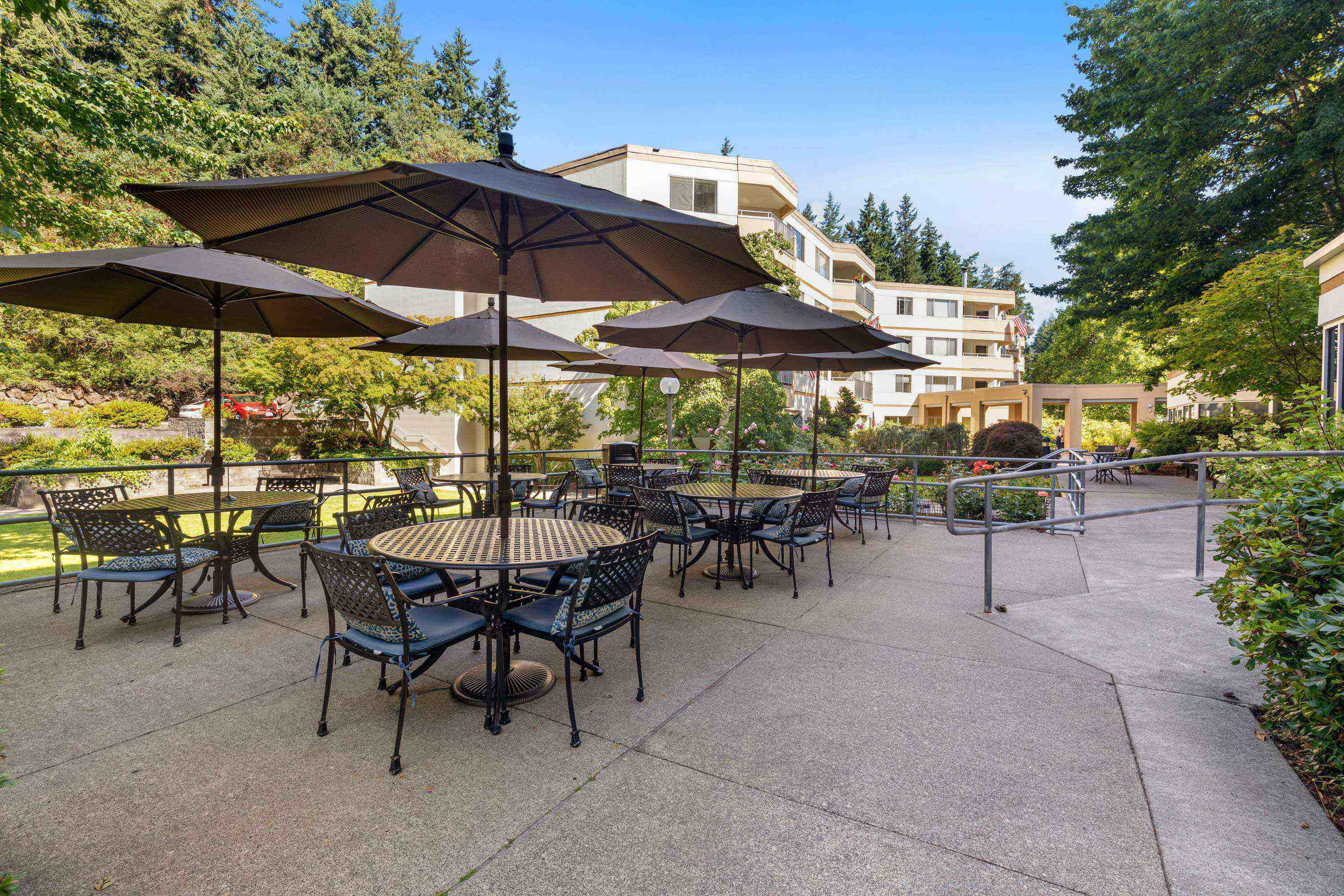 Umbrellaed tables on the patio at Cristwood