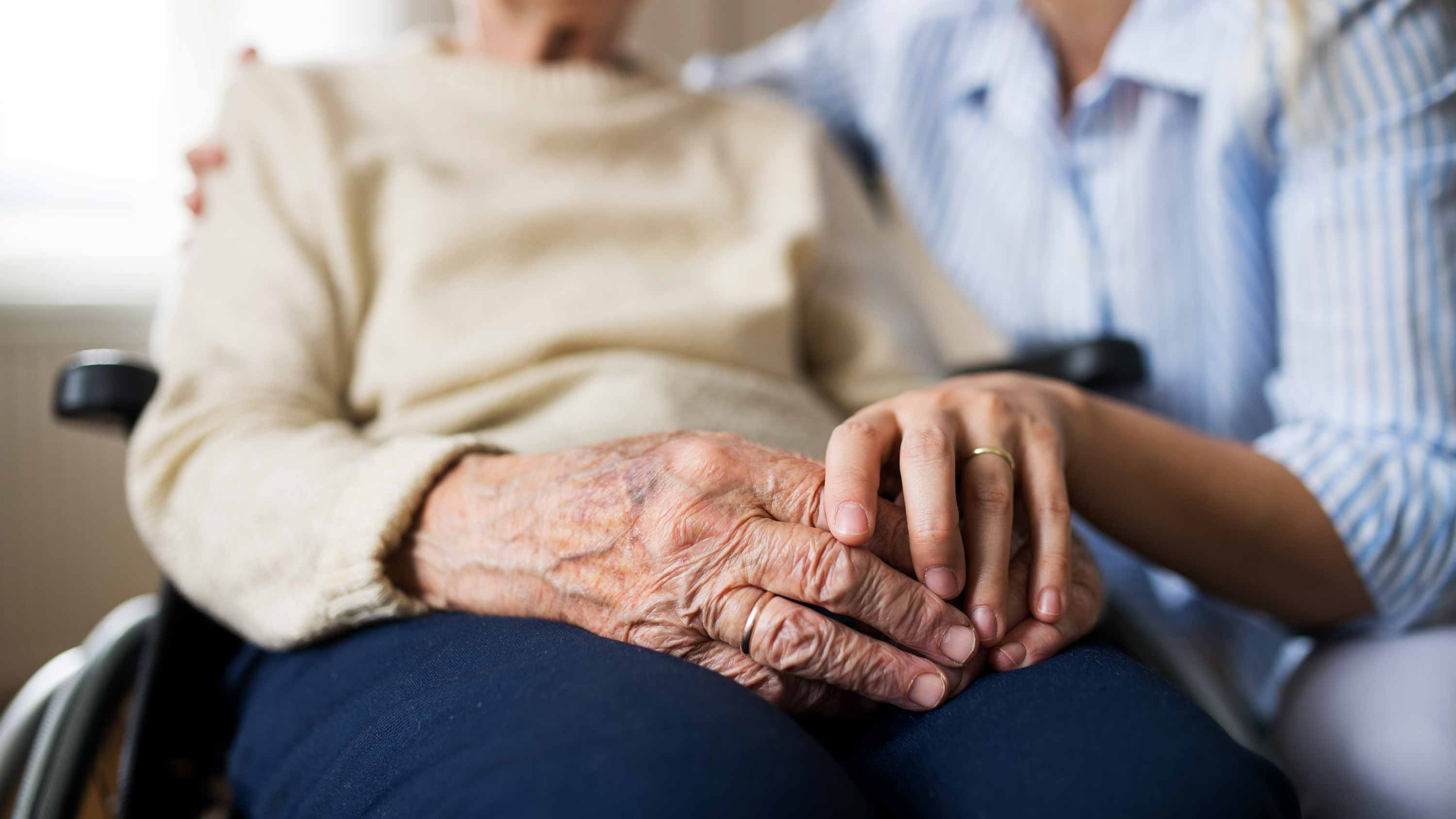 Caregiver with wheelchair-bound resident