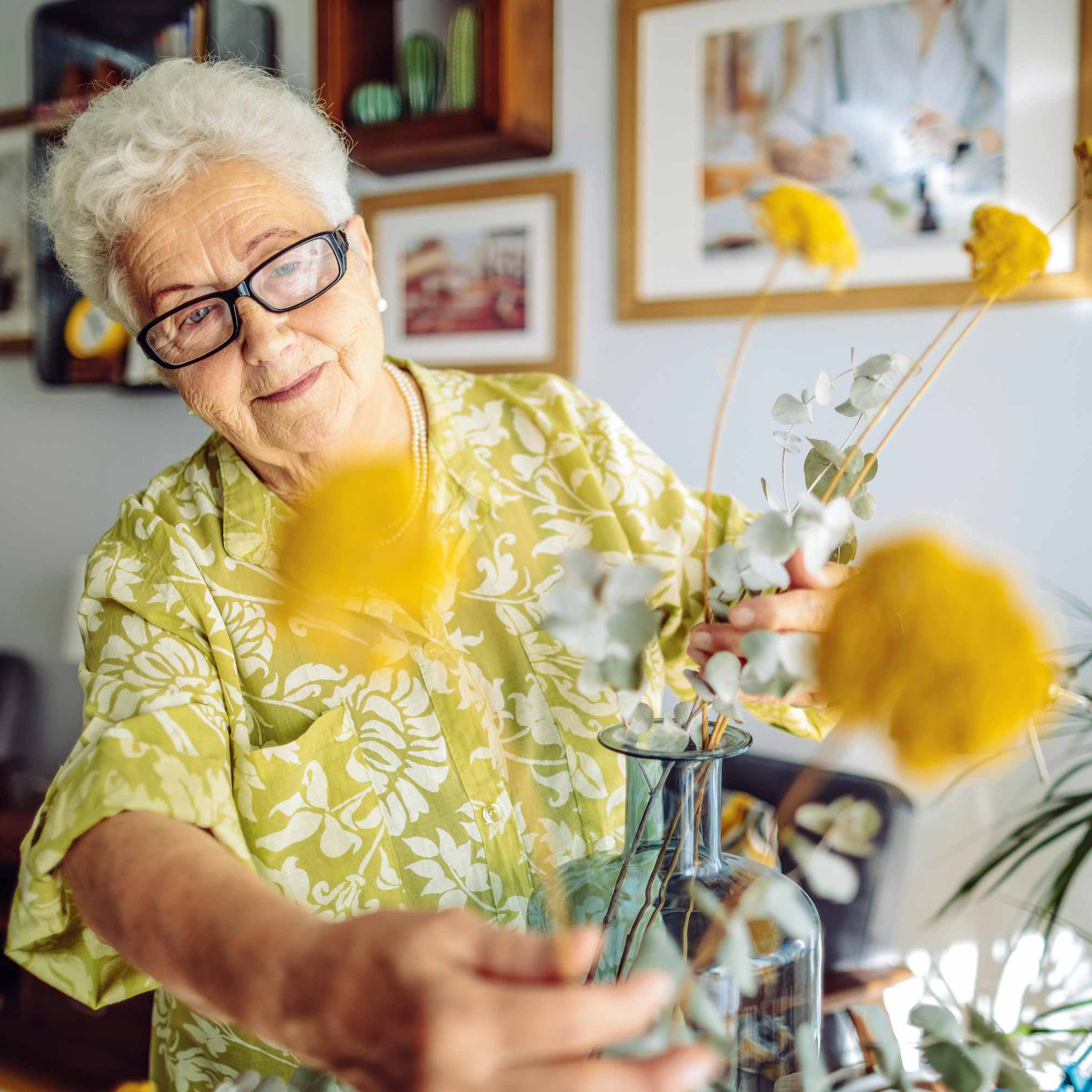 CRISTA Senior Living - Woman arranging flowers