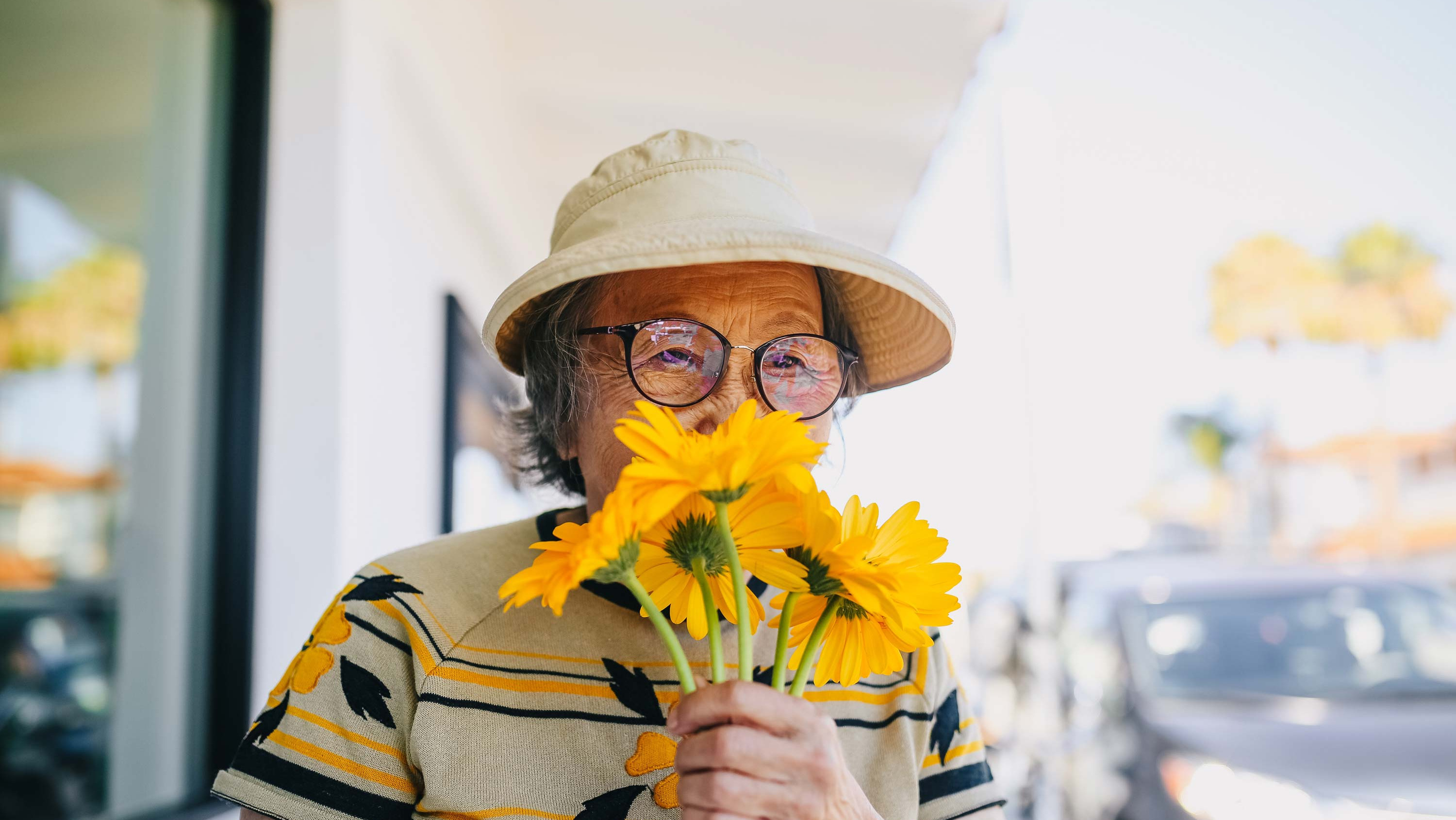 CRISTA Senior Living Blog Woman smelling flowers
