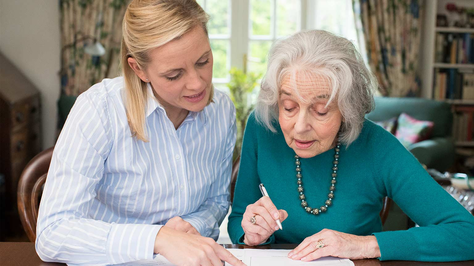 CRISTA Senior Living Blog - getting affairs in order - woman signing will