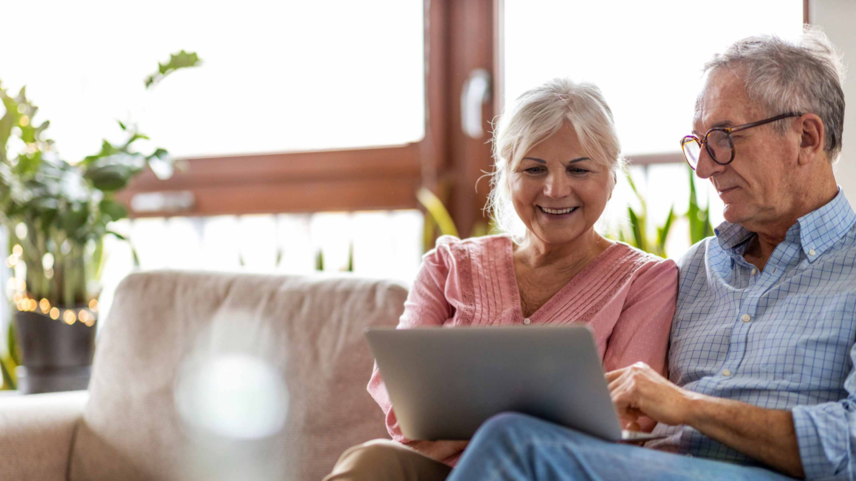 Couple work together on a laptop computer