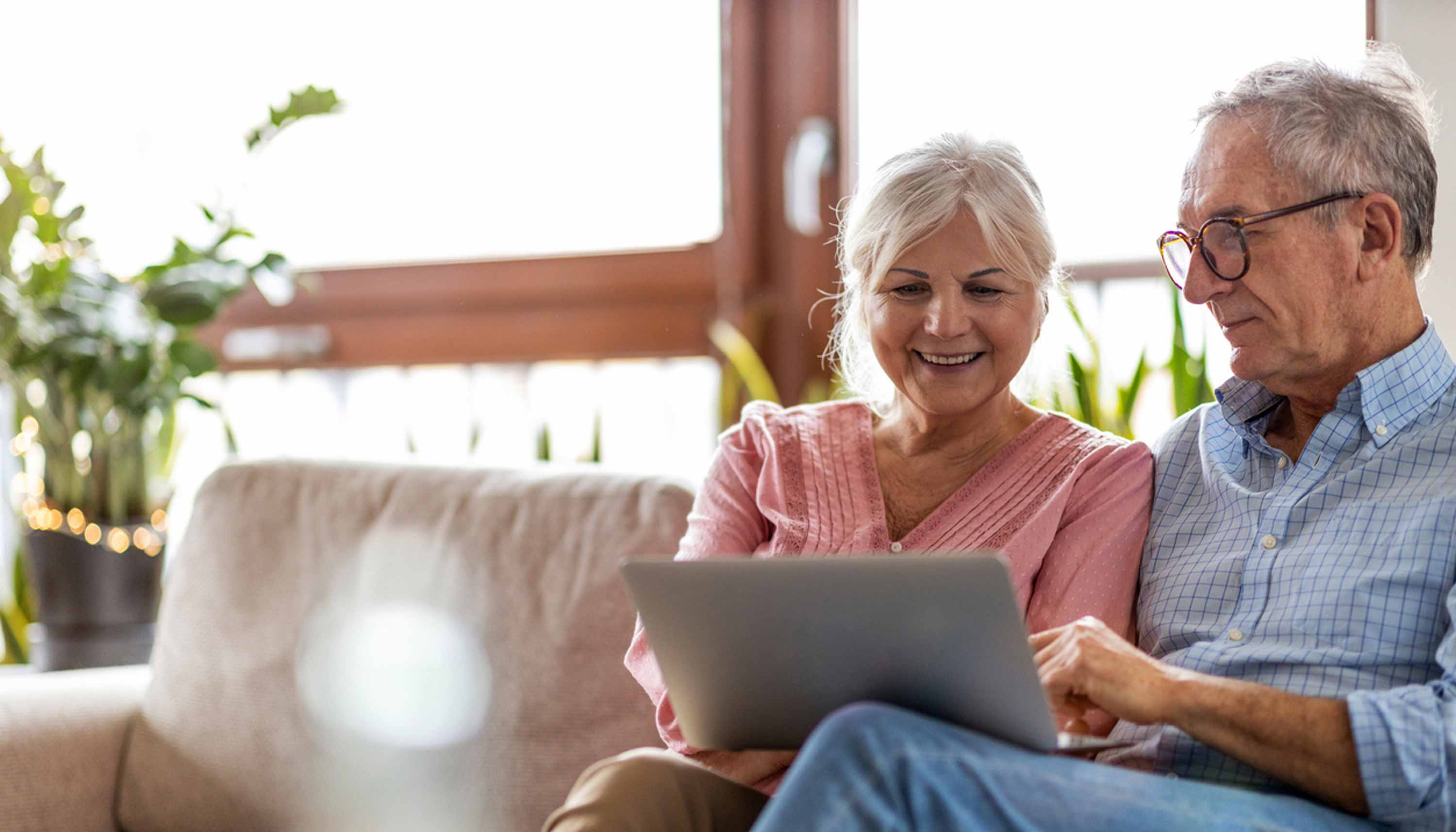 Couple work together on a laptop computer