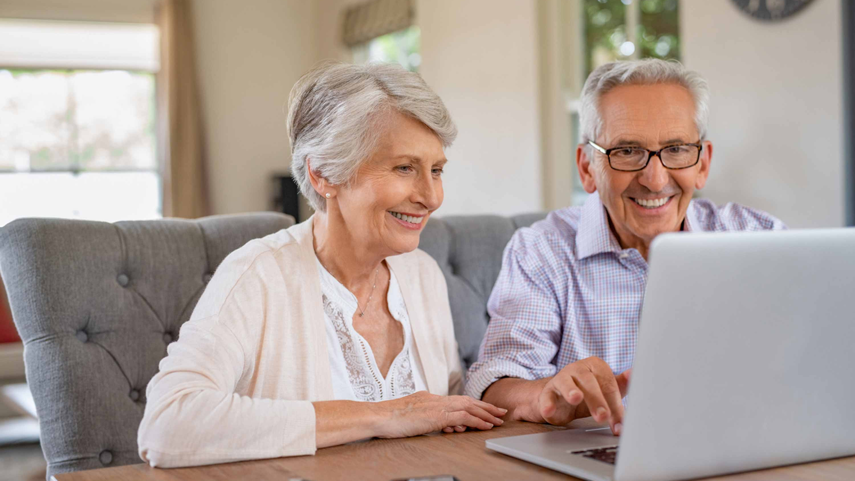 Couple working together on a laptop computer