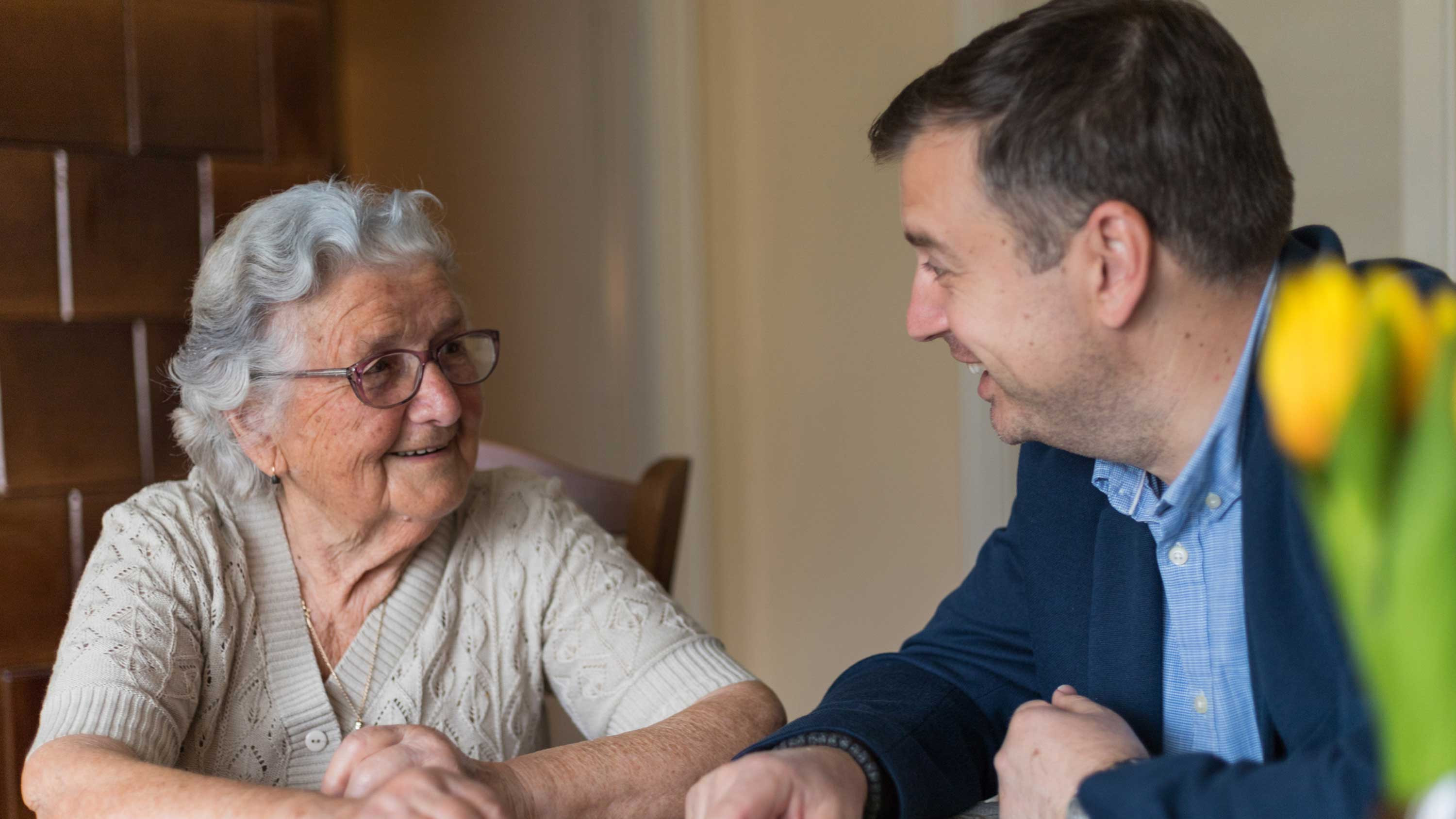 CRISTA Senior Living - Grandmother and grandson talking about memory care