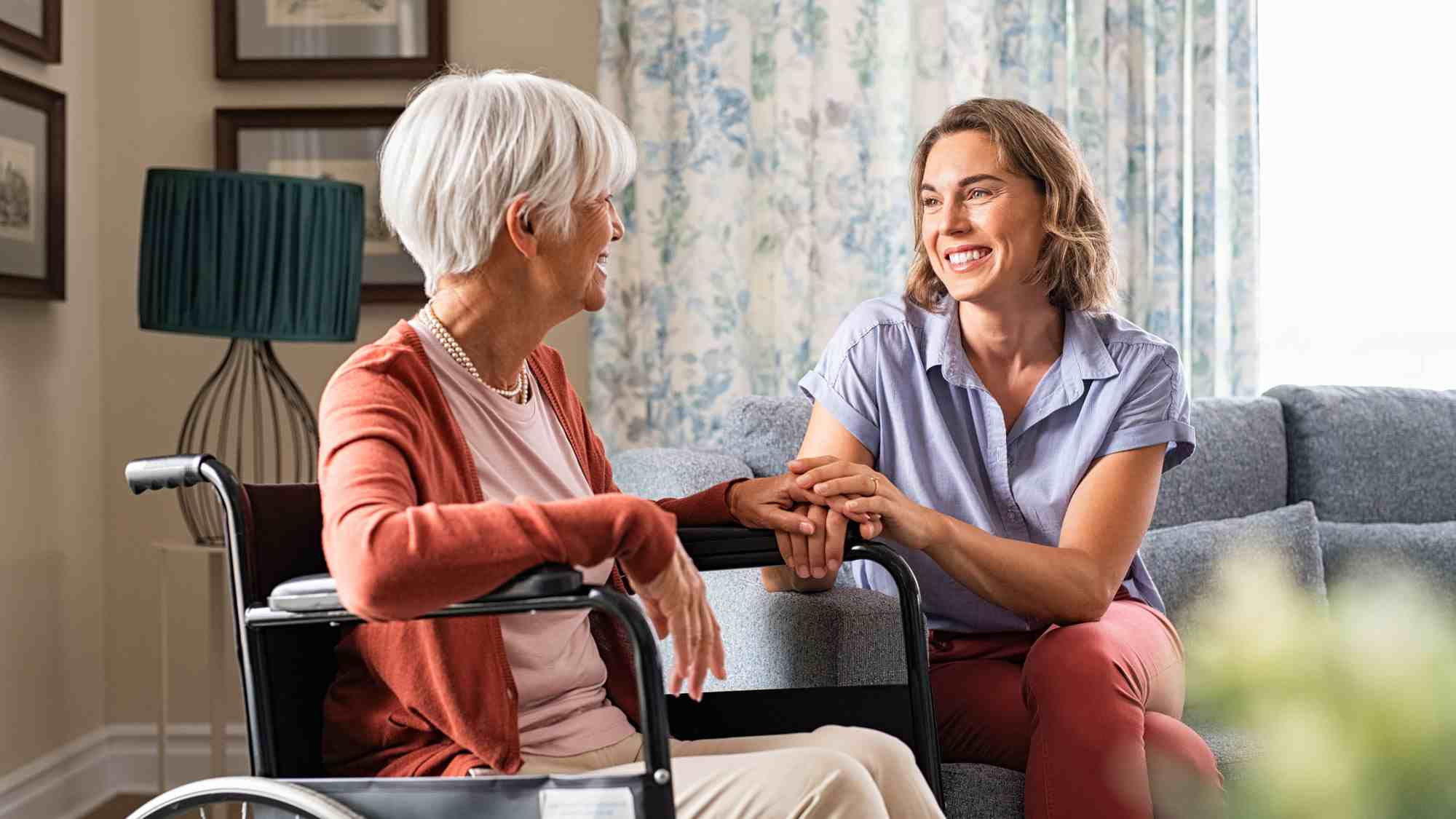 CRISTA Senior Living - Level of care - Senior in wheelchair talking with nurse